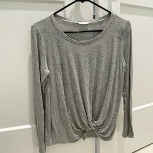 Grey blouse with twist hem in front